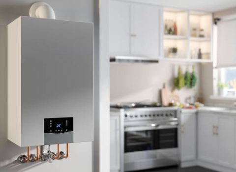 Close-up Of Boiler With Blurred Kitchen Background