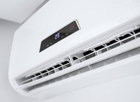 Split air conditioner on a white wall. Closeup image.